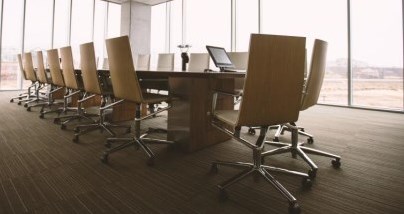 Meeting table in a room full of windows