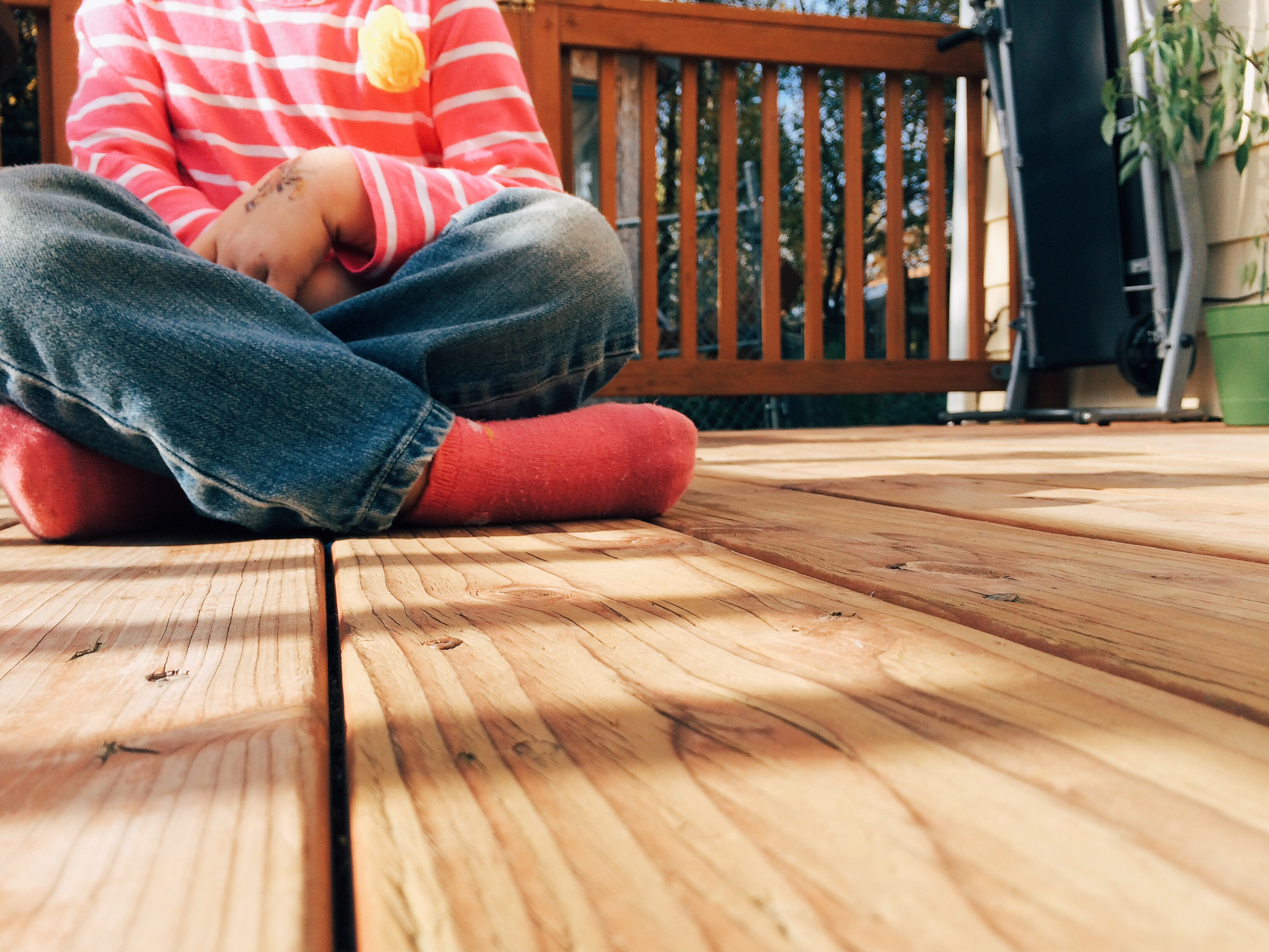 Photo of child sitting on deck by Jeri Johnson