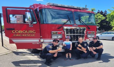 Cobourg Firefighters with child